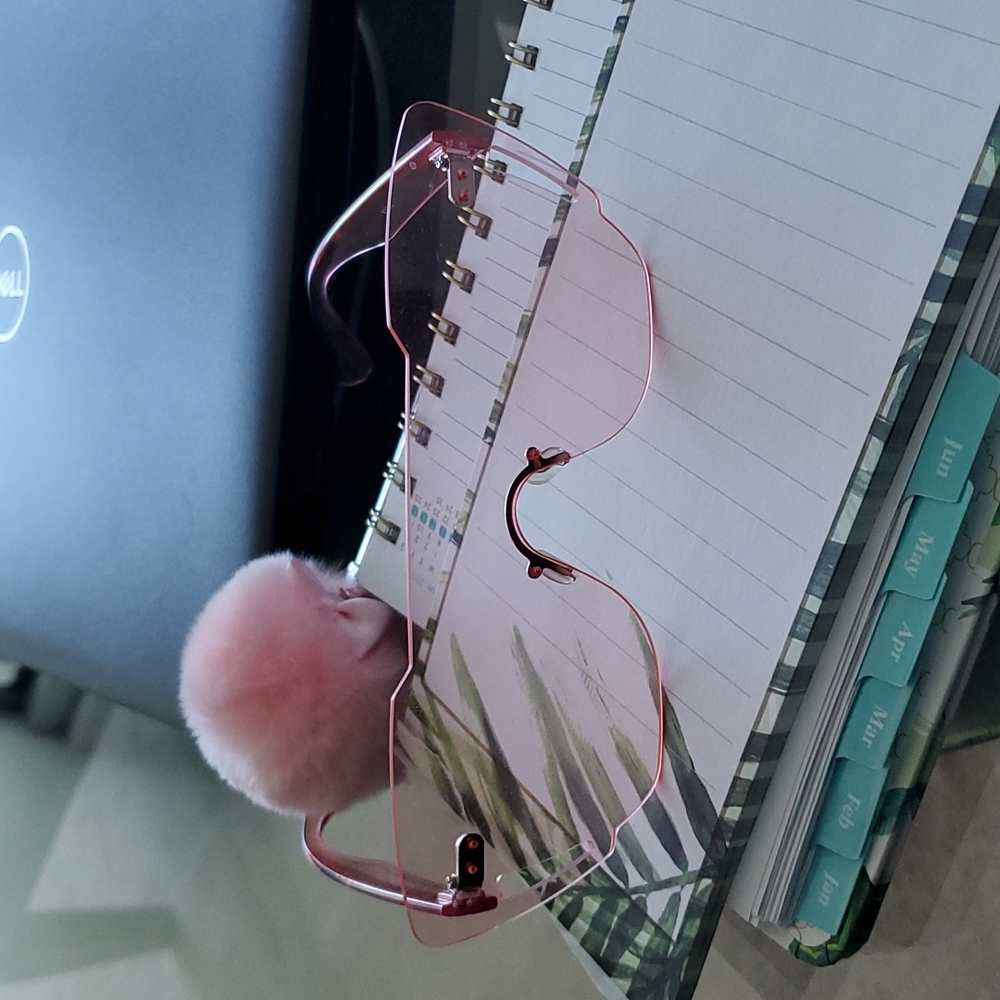 Pale pink see through sunglasses